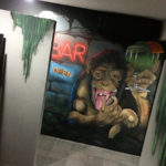 hostel drinking monkey mural